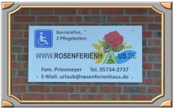 Rosenferienhaus Werbeschild an der Nordsee